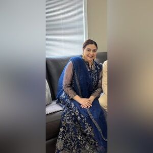 Elegant Blue Embroidered Dress
Saree